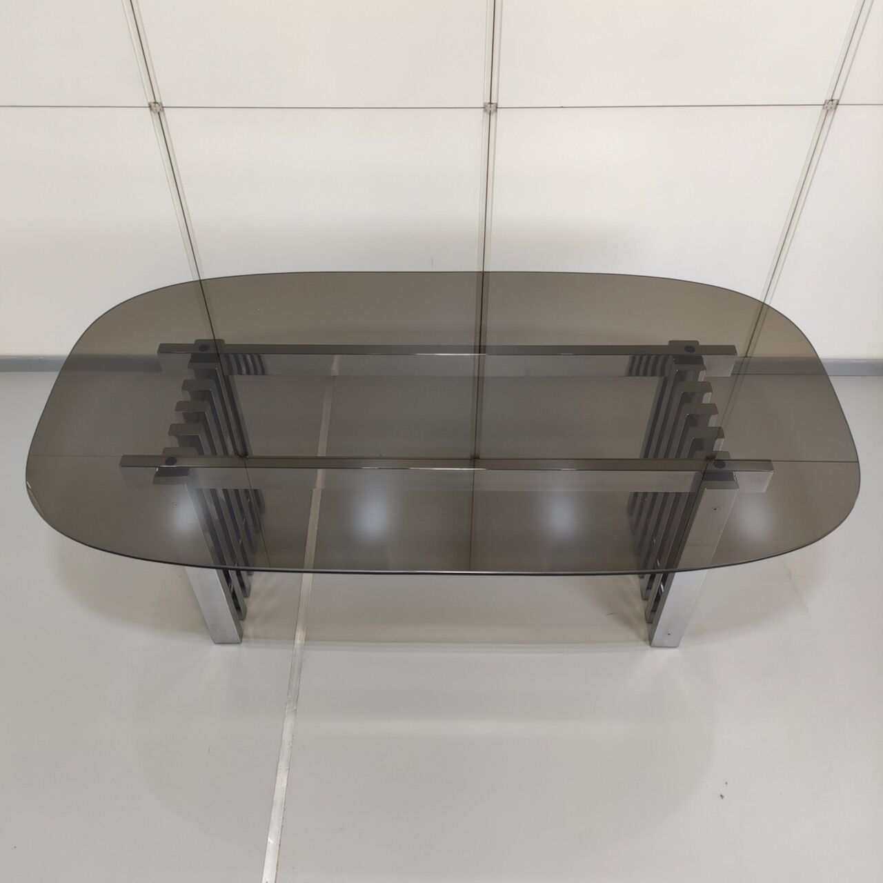 Chrome base diningroom table with smoked glass oval top