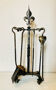 Mid-20th century fireplace accessories in wrought iron with fleur-de-Lys.