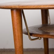 Round coffee table, two levels, danish in teak, brass and cannage