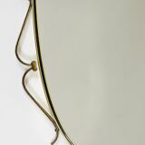Elegant wall mirror in brass and black from the mid-century, Italy, 1950s.