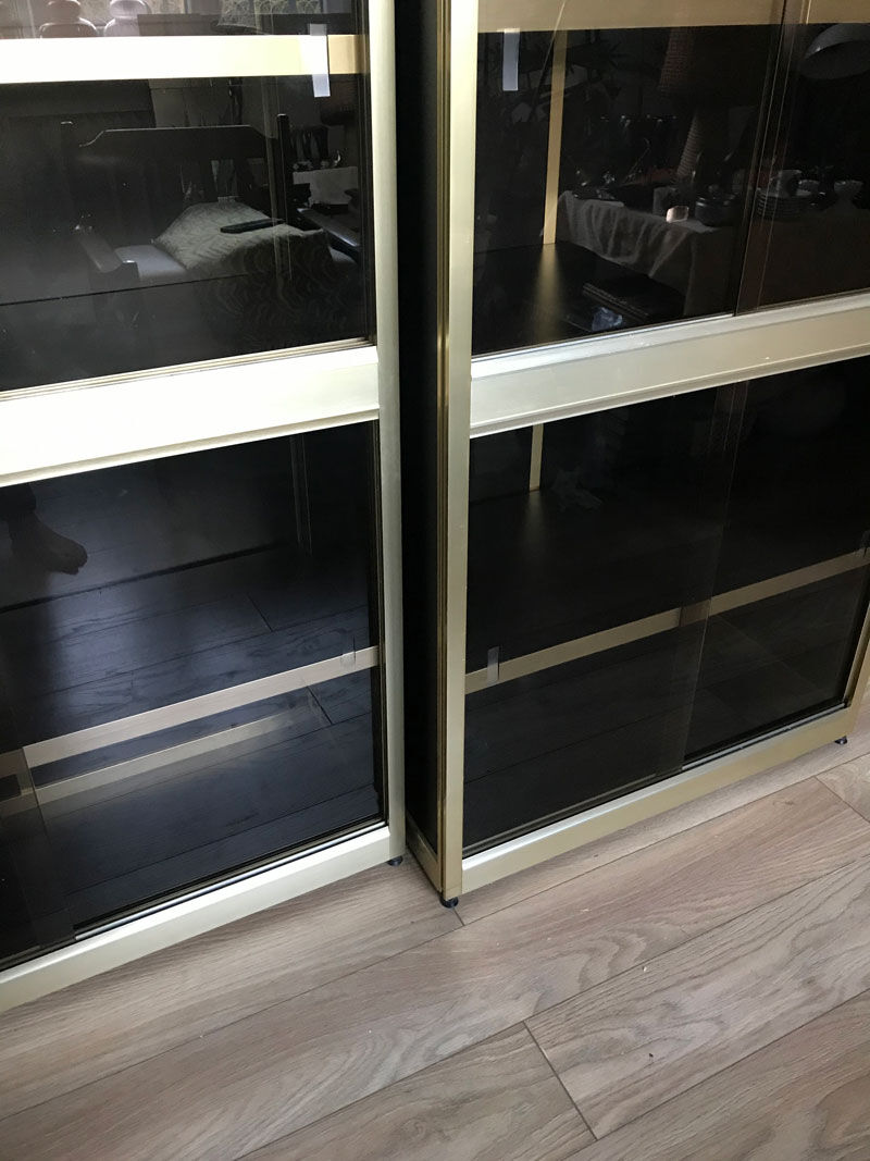 Shelves of black and gold windows