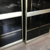 Shelves of black and gold windows