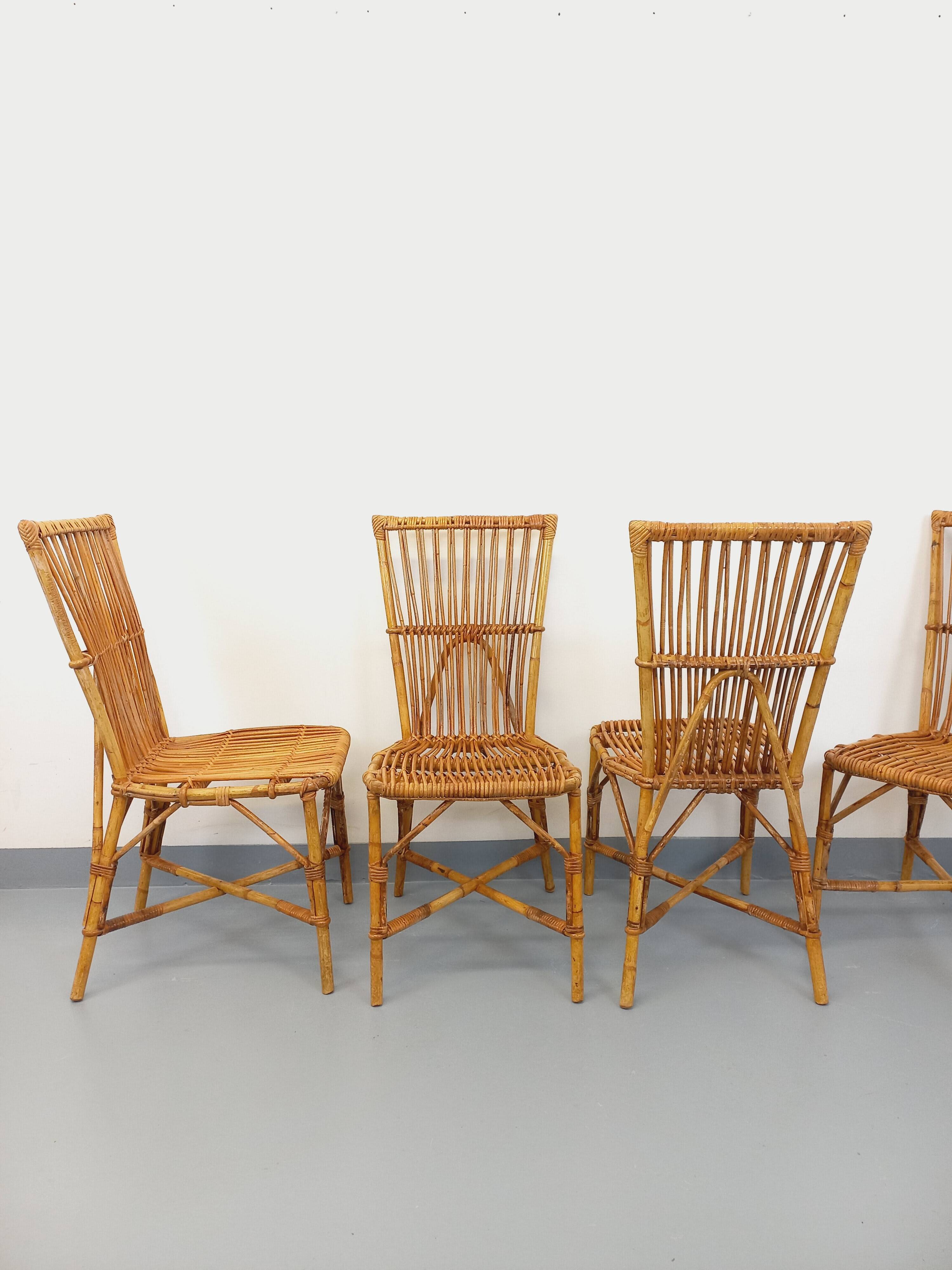 Set of 4 vintage Audoux Minet rattan chairs from the 1950s and 60s.