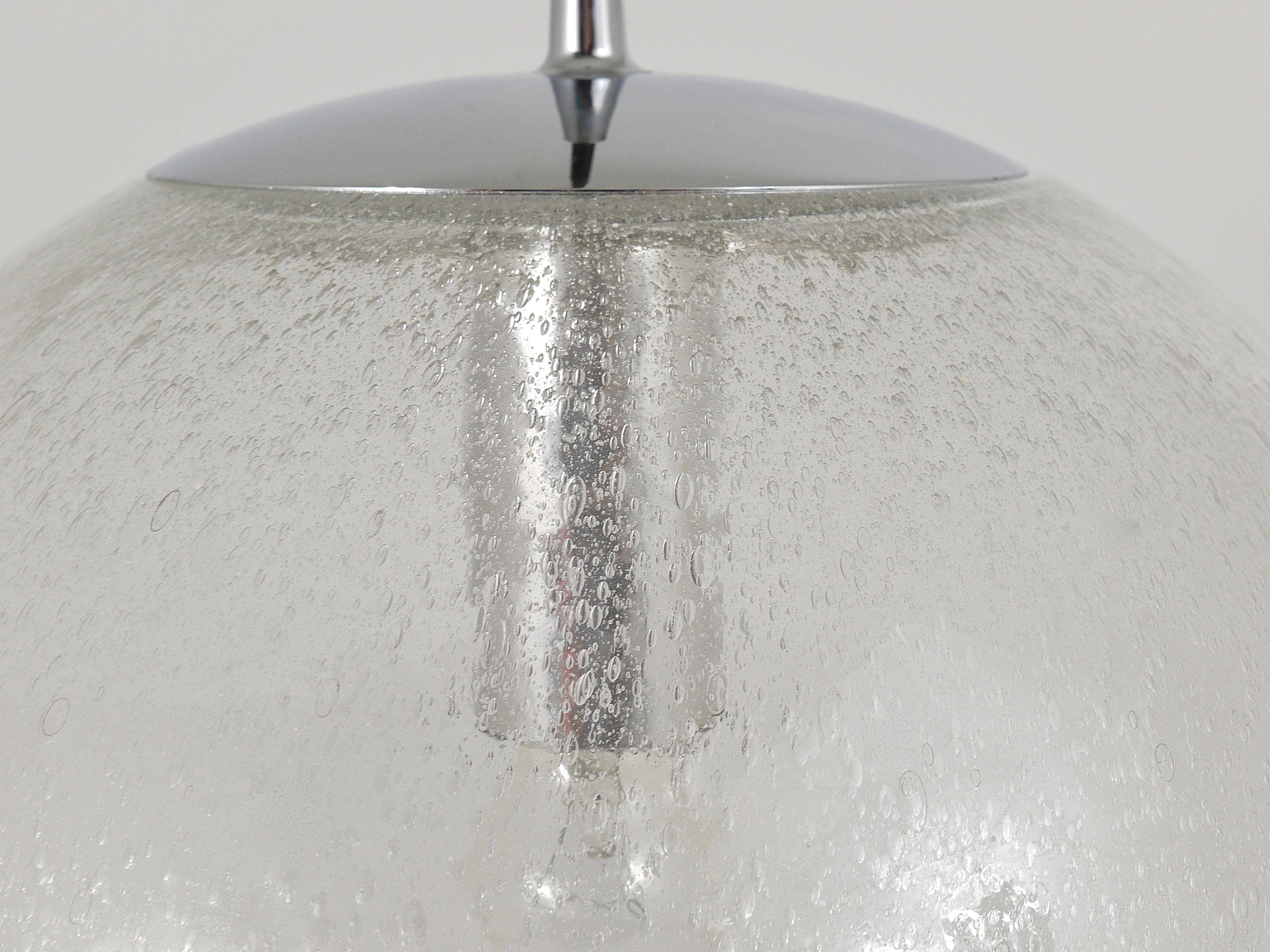 Large glass globe pendant light with bubbles and chrome by Peil & Putzler, Germany, 1970s.