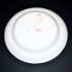 Saint-Clément earthenware rooster plate with floral medallion and ribbon decoration