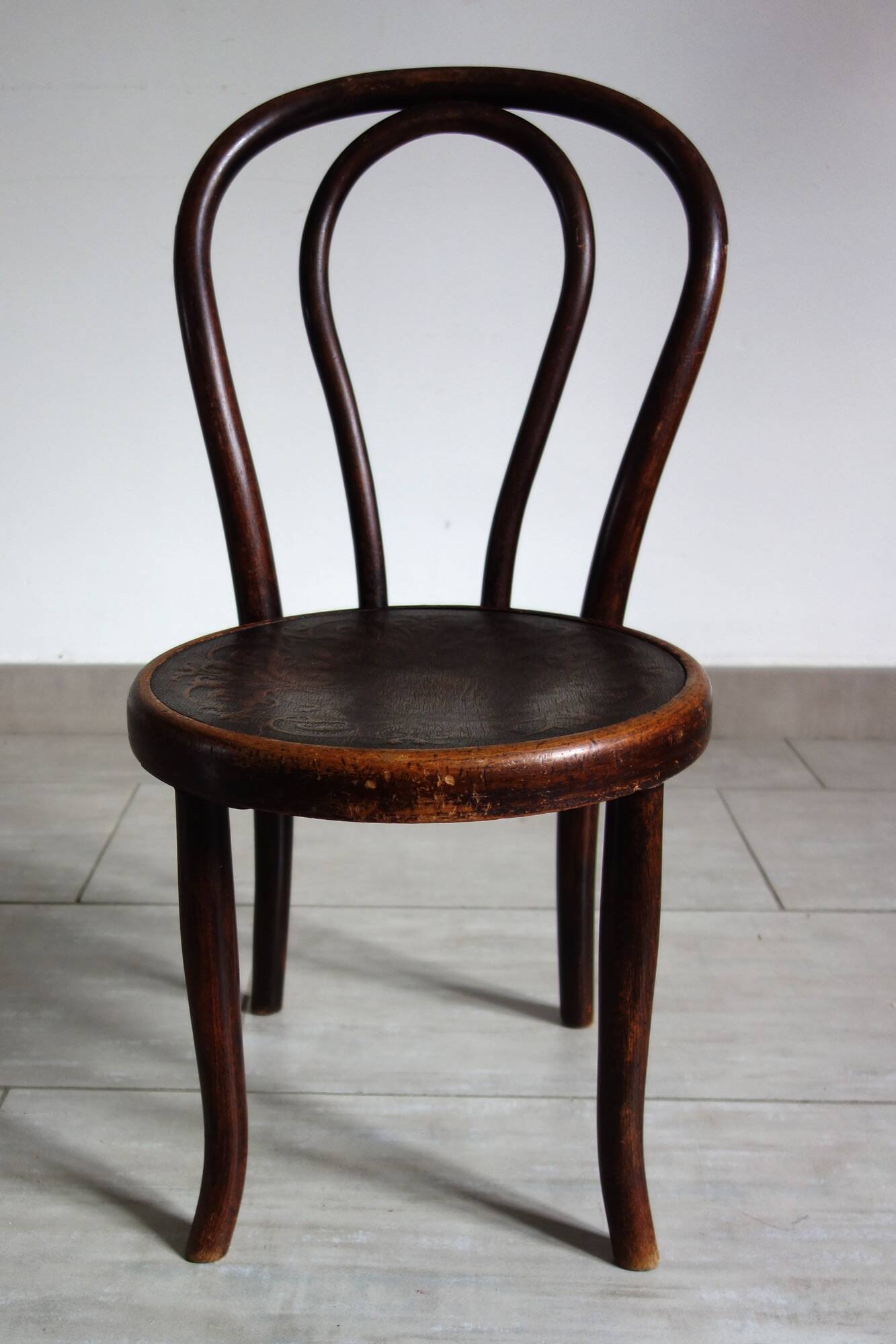Antique curved wooden children's chair by Fischel, early 20th century.