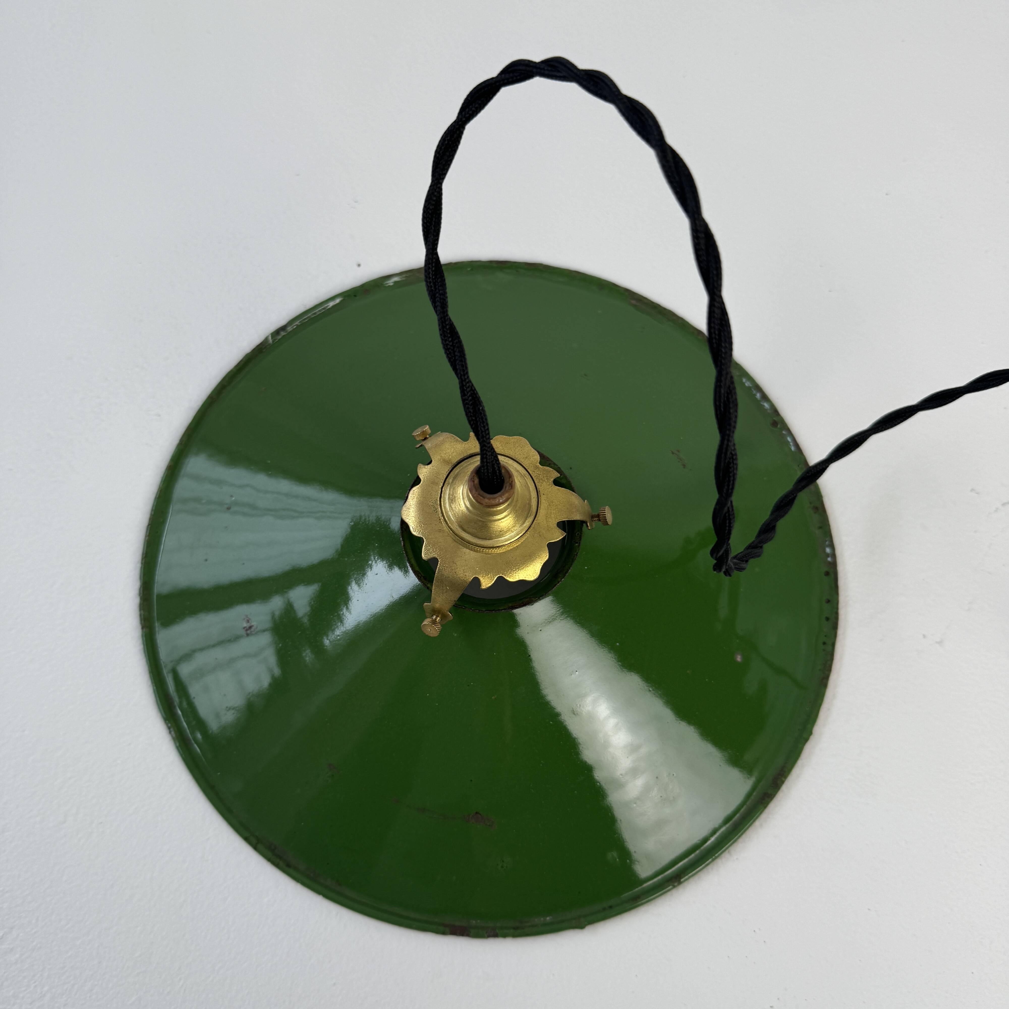 Old conical industrial pendant light in green enamelled sheet metal