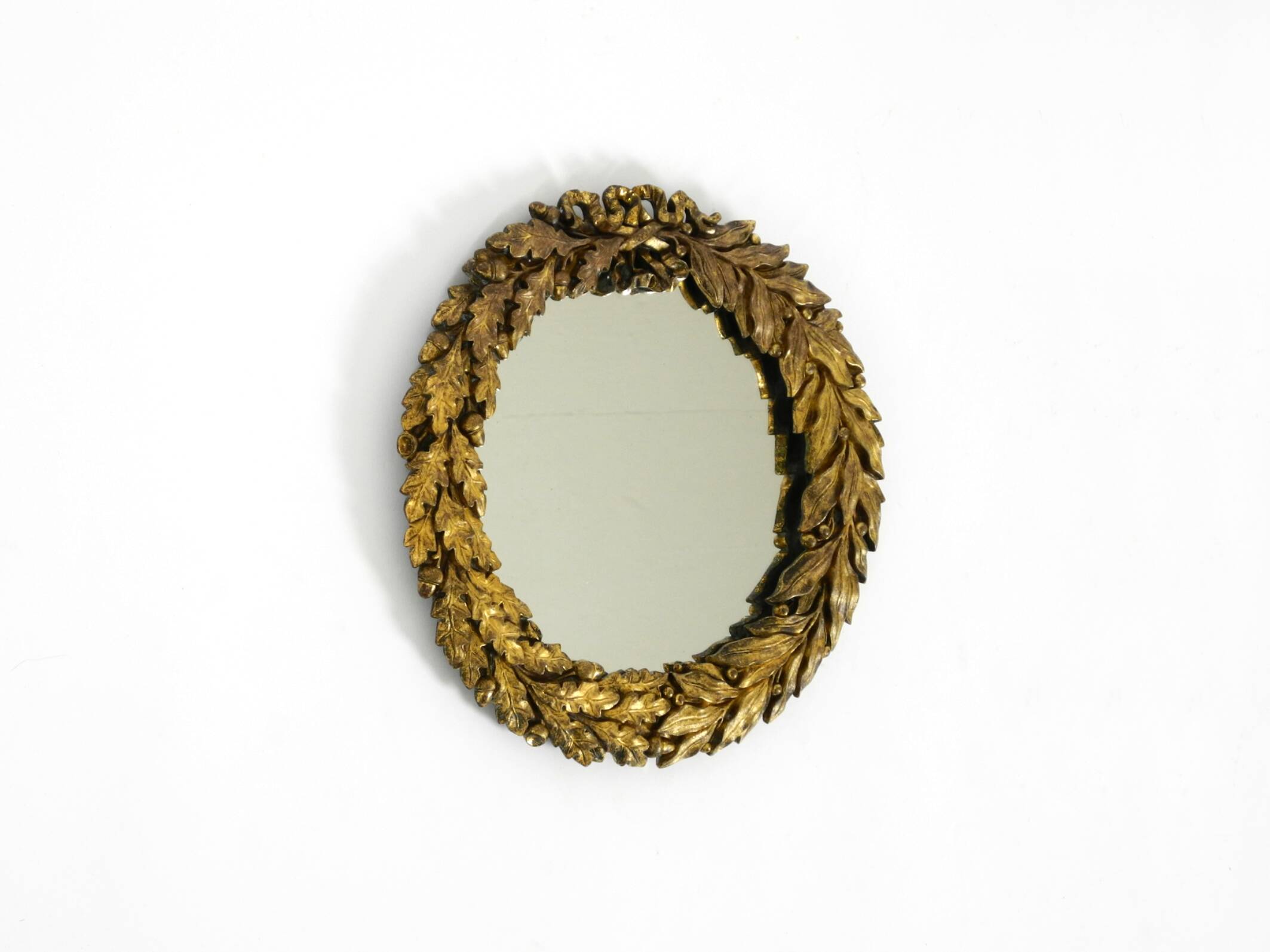 Beautiful small French mid-century wall mirror with an ornate brass frame