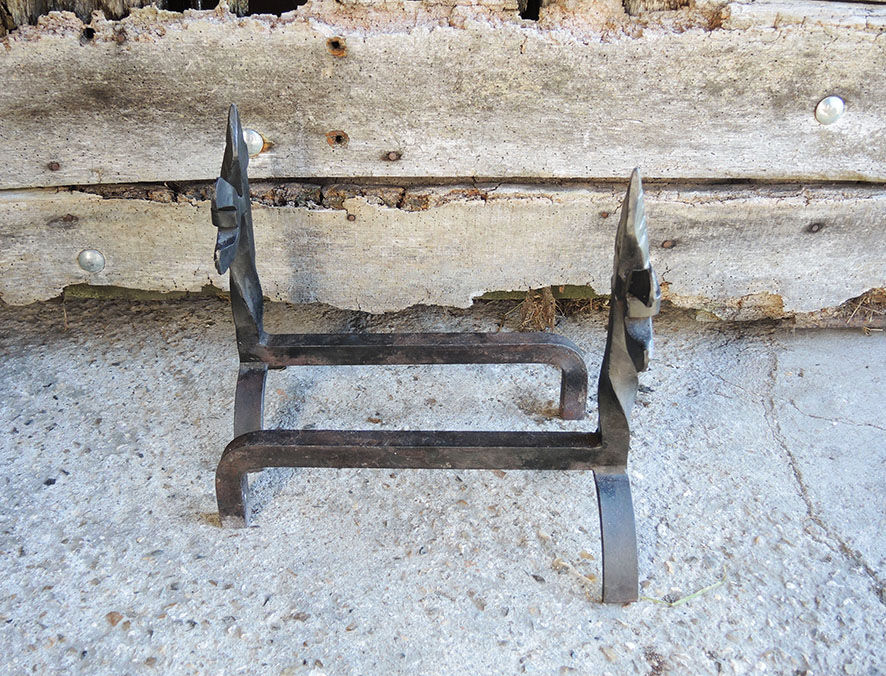 Old chenets fleur de lys in wrought iron