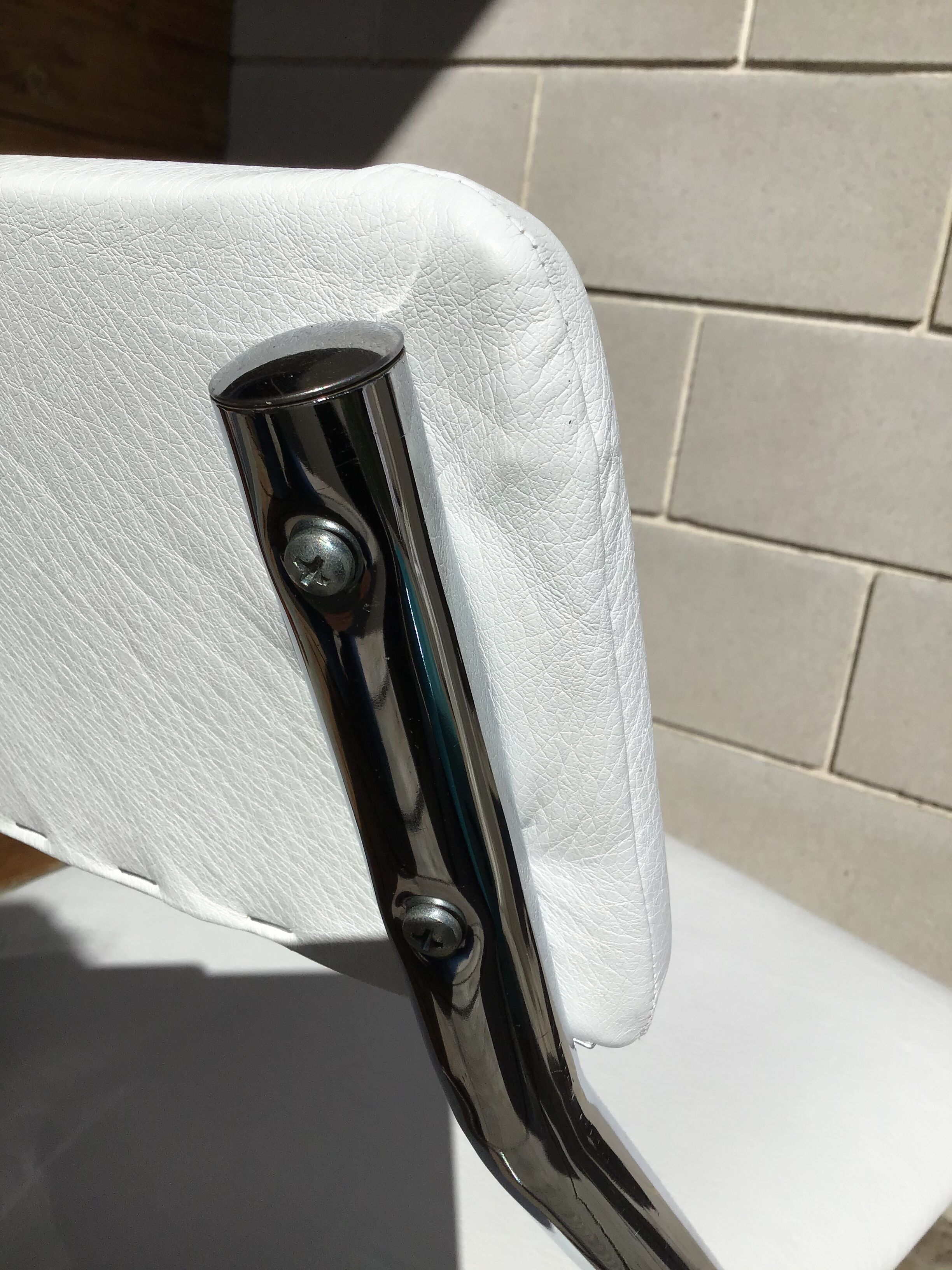 White faux leather sled chair