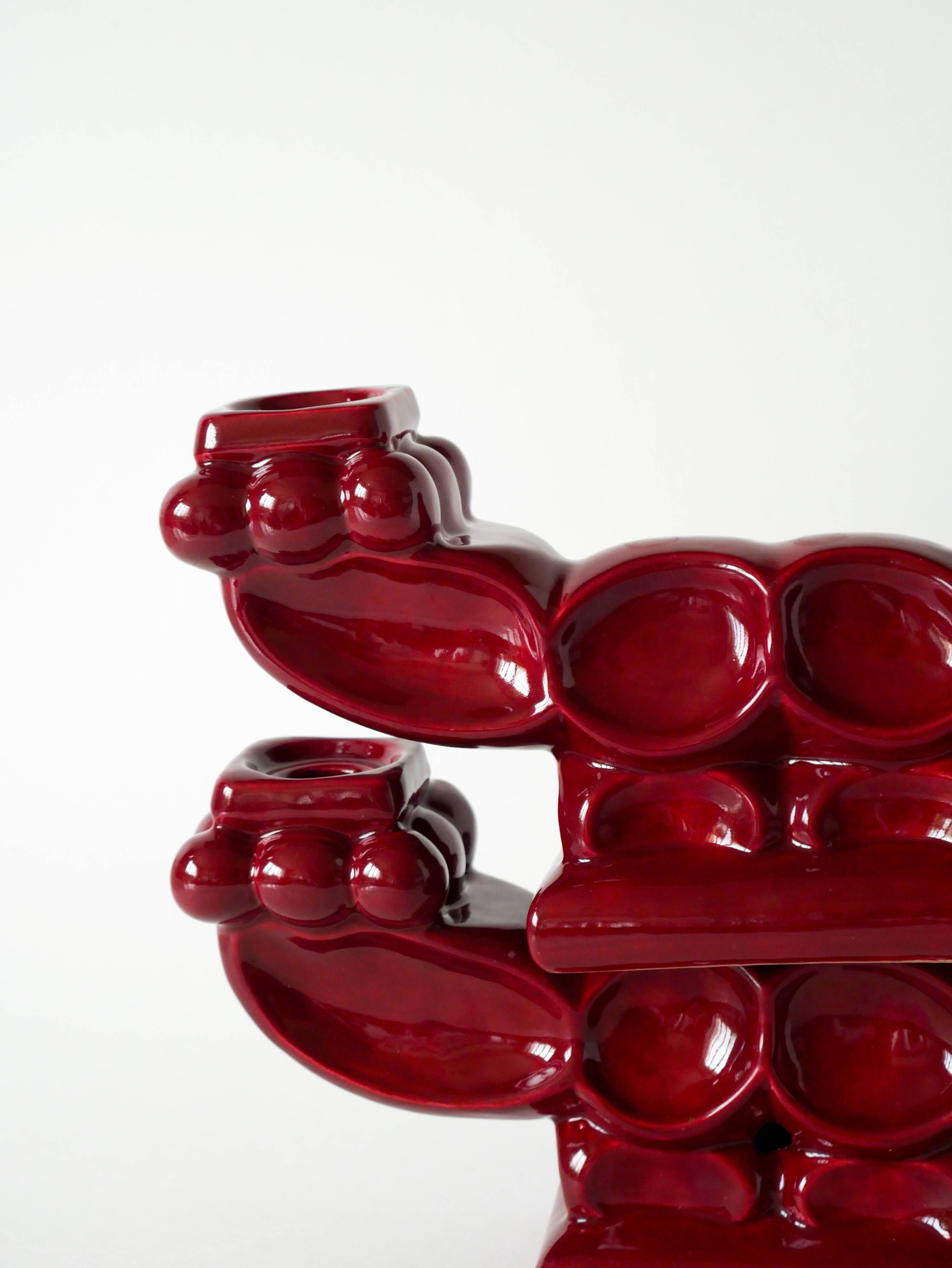 Pair of large burgundy ceramic candlesticks, 1950