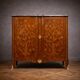 Wooden cabinet with doors, richly inlaid with floral patterns, Louis XV style.