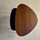 A pair of tripod and nesting coffee tables in walnut and midnight blue.