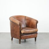 Sturdy vintage sheepskin club armchair with a beautiful patina