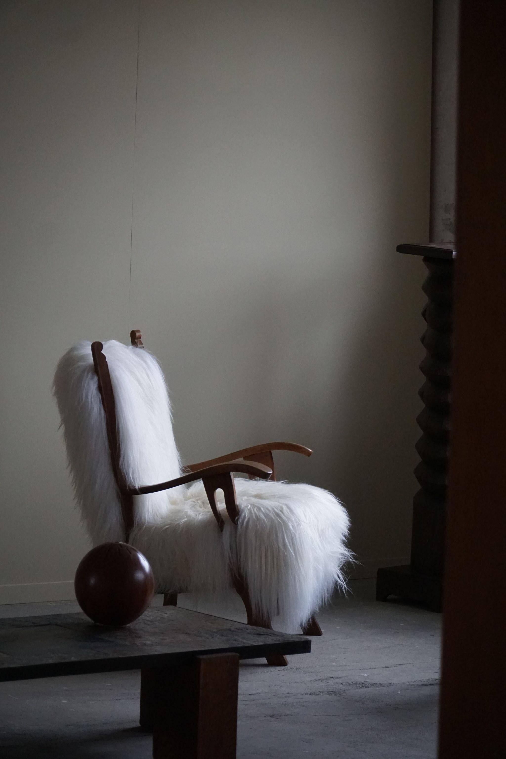 Henning Kjærnulf, armchair reupholstered in long-haired Icelandic sheepskin, 1950