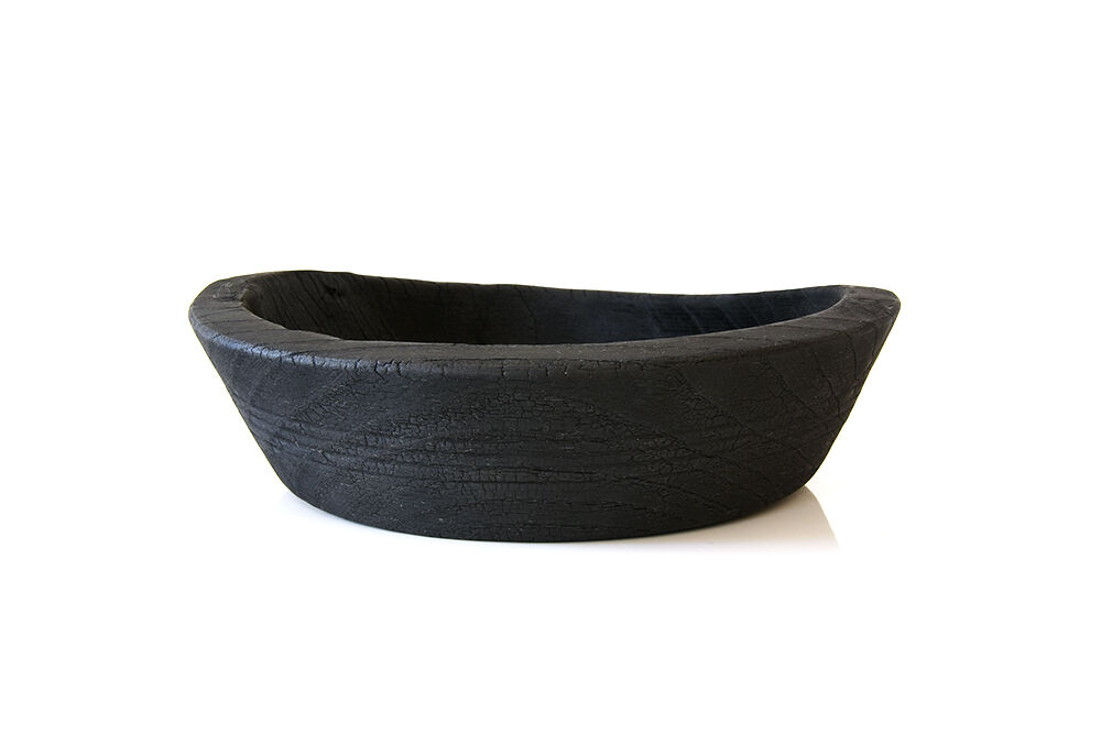 Cut / empty pocket in burning wood. shou-sugi-ban