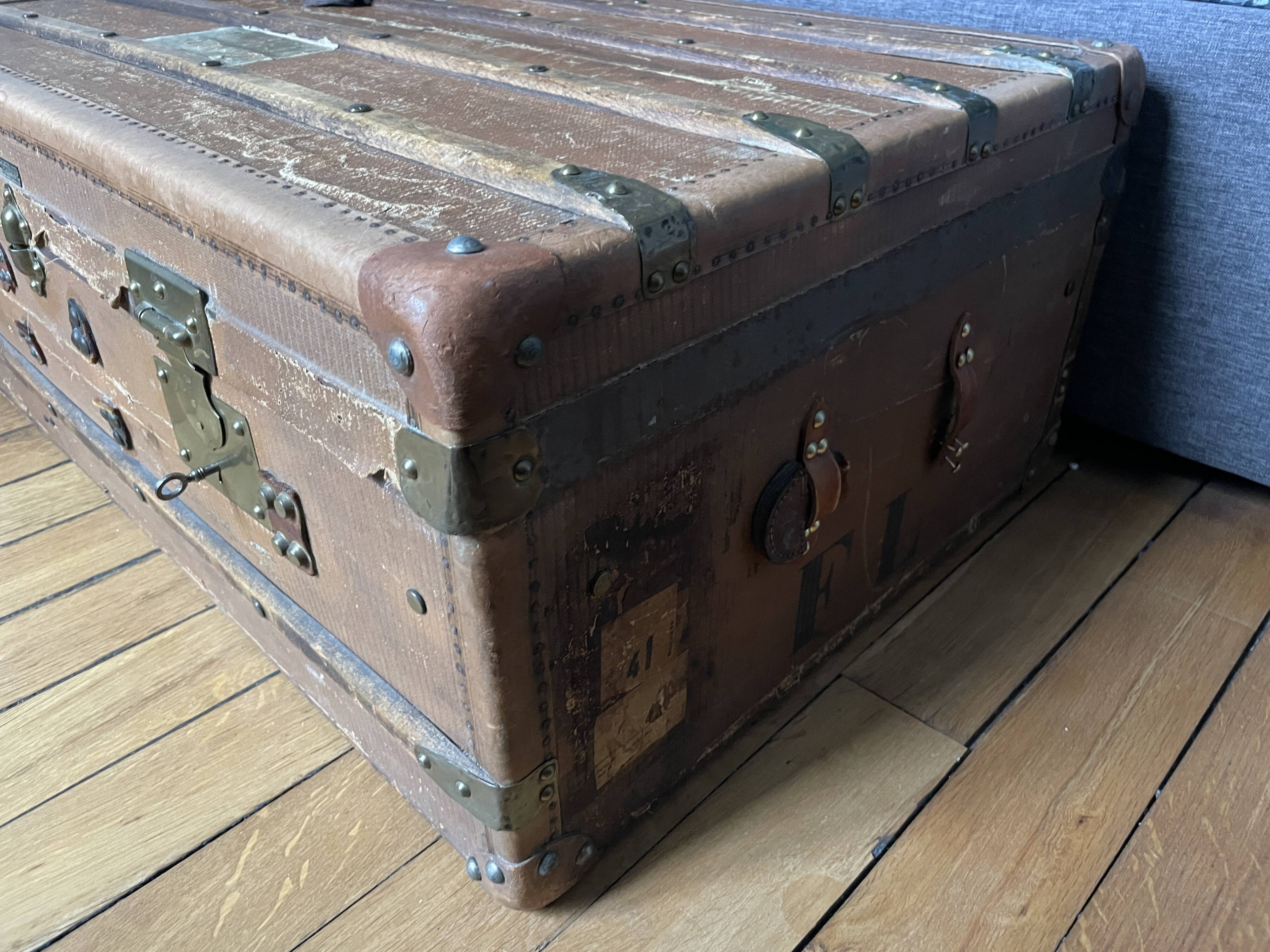 Large antique trunk with a key closure.