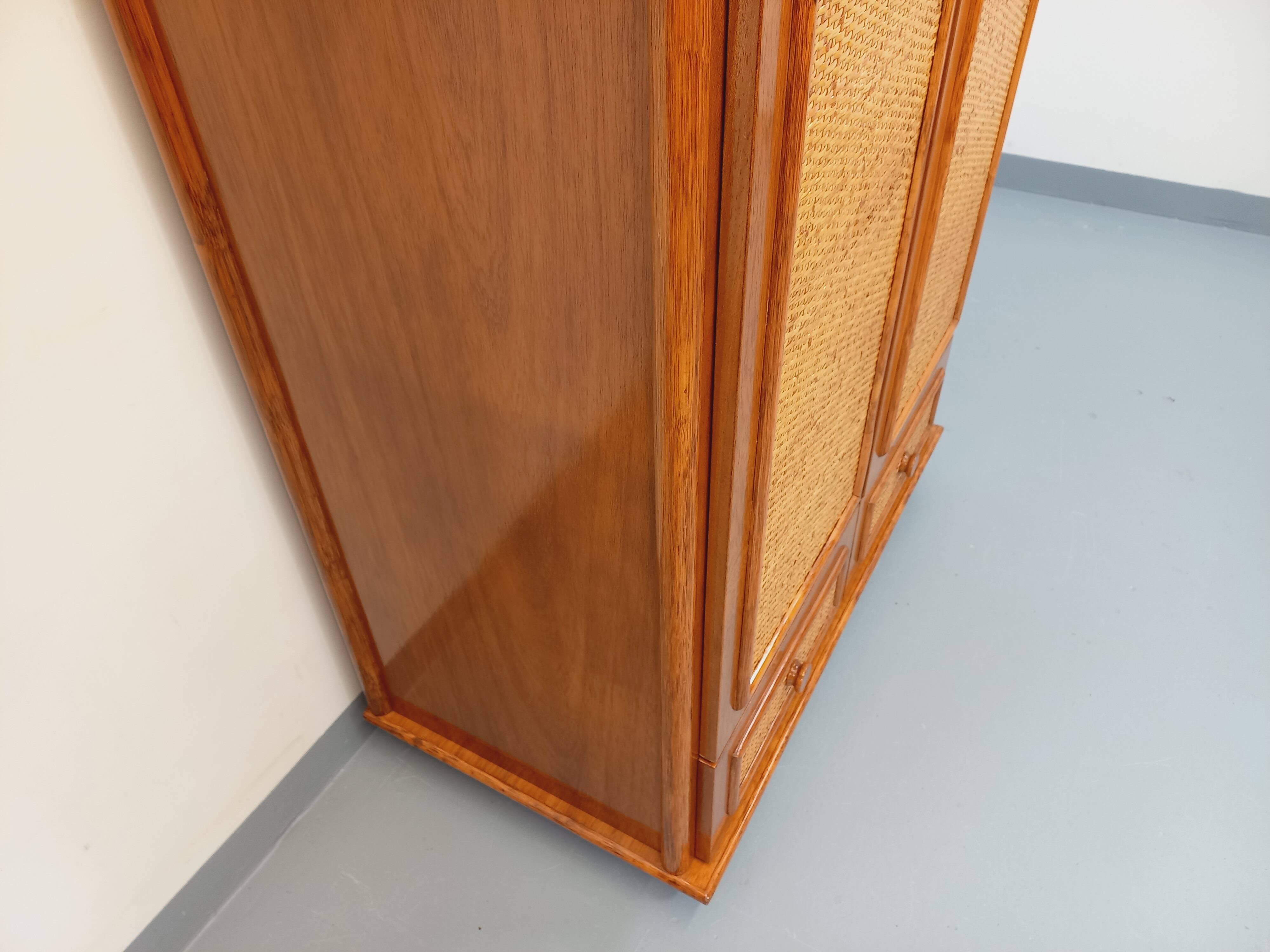 Vintage woven rattan and wood armoire by Maugrion for Roche-Bobois.
