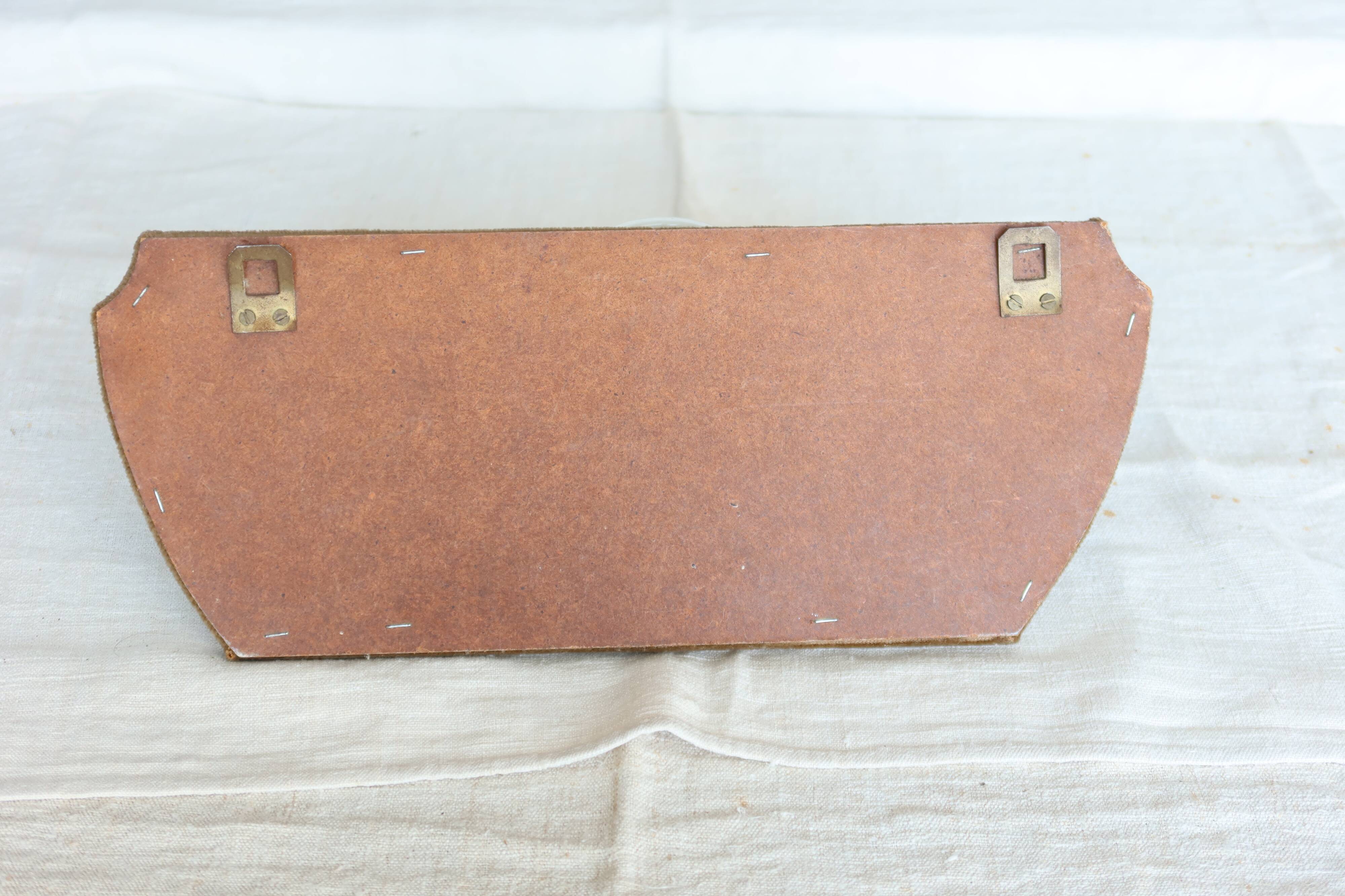 Vintage velvet coat rack with brass hooks