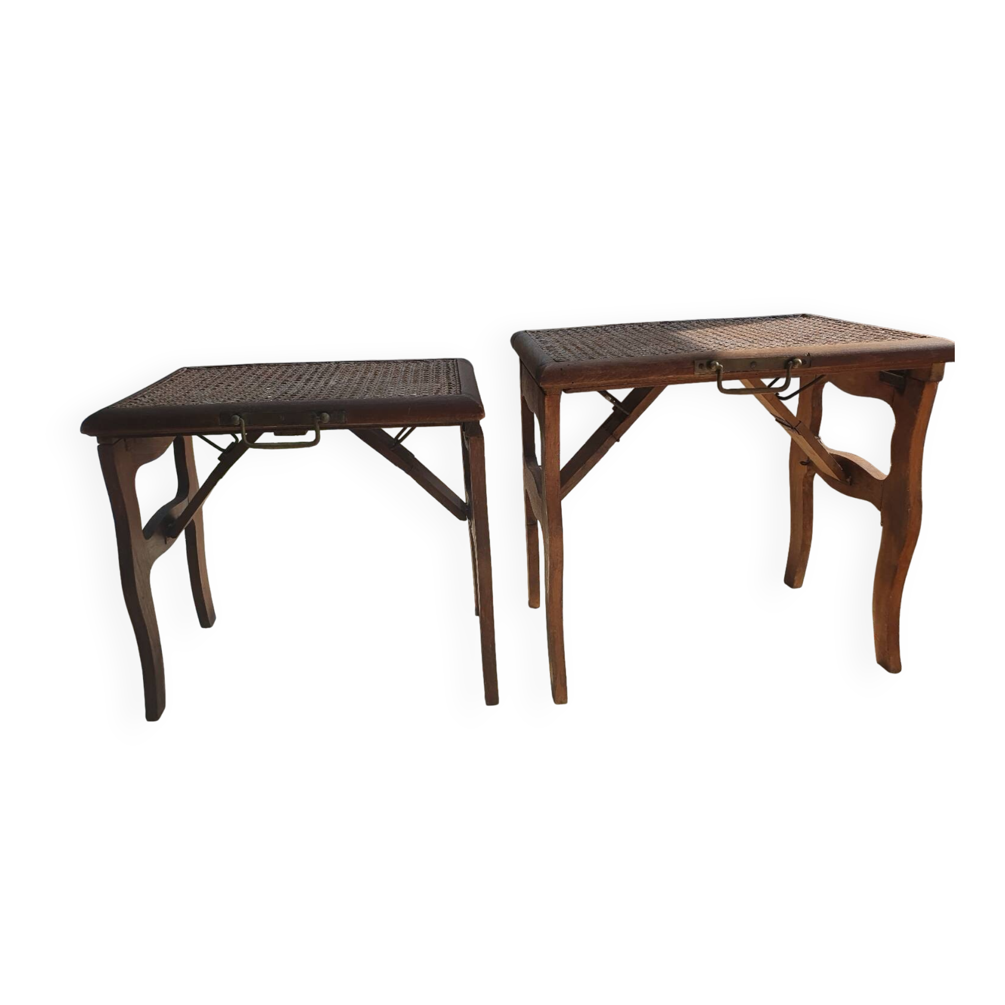 Two folding stools with caned seats.