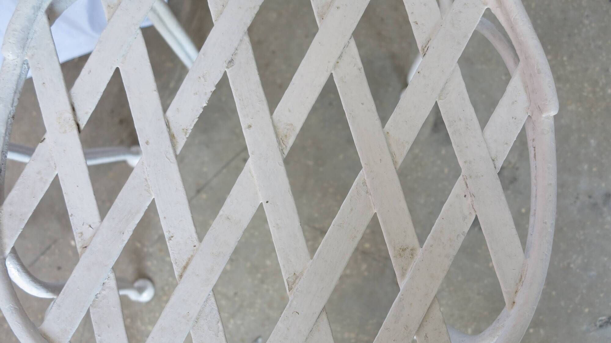 Pair of antique garden chairs, wrought iron, white paint.