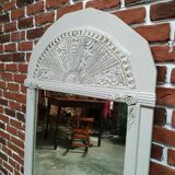 White and gold patinated sculpted mirror