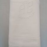 White flat sheet with AG monogram