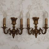 Pair of French baroque brass wall sconces with two branches, decorated with acanthus and wickerwork.