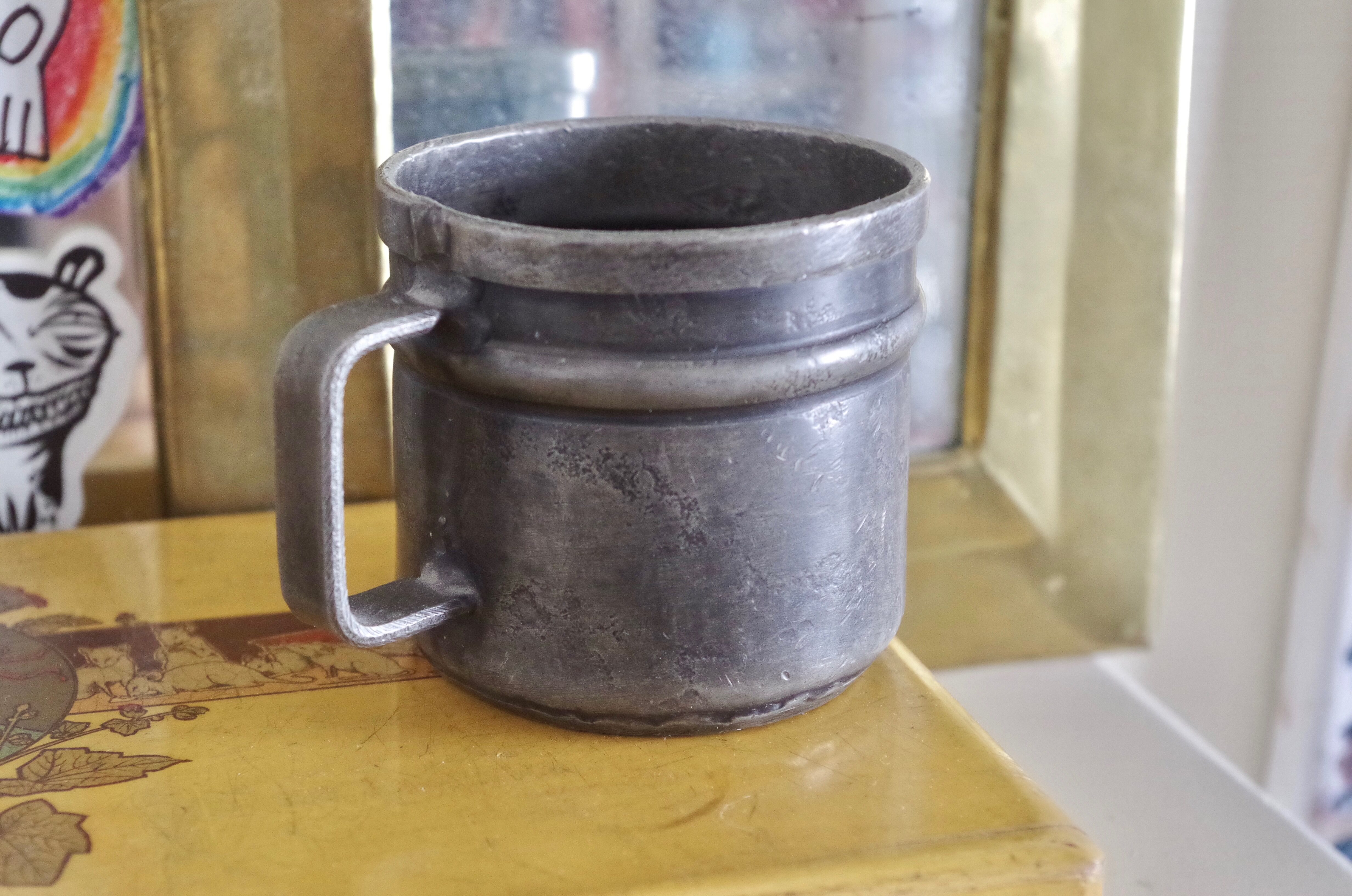 Old tin cup