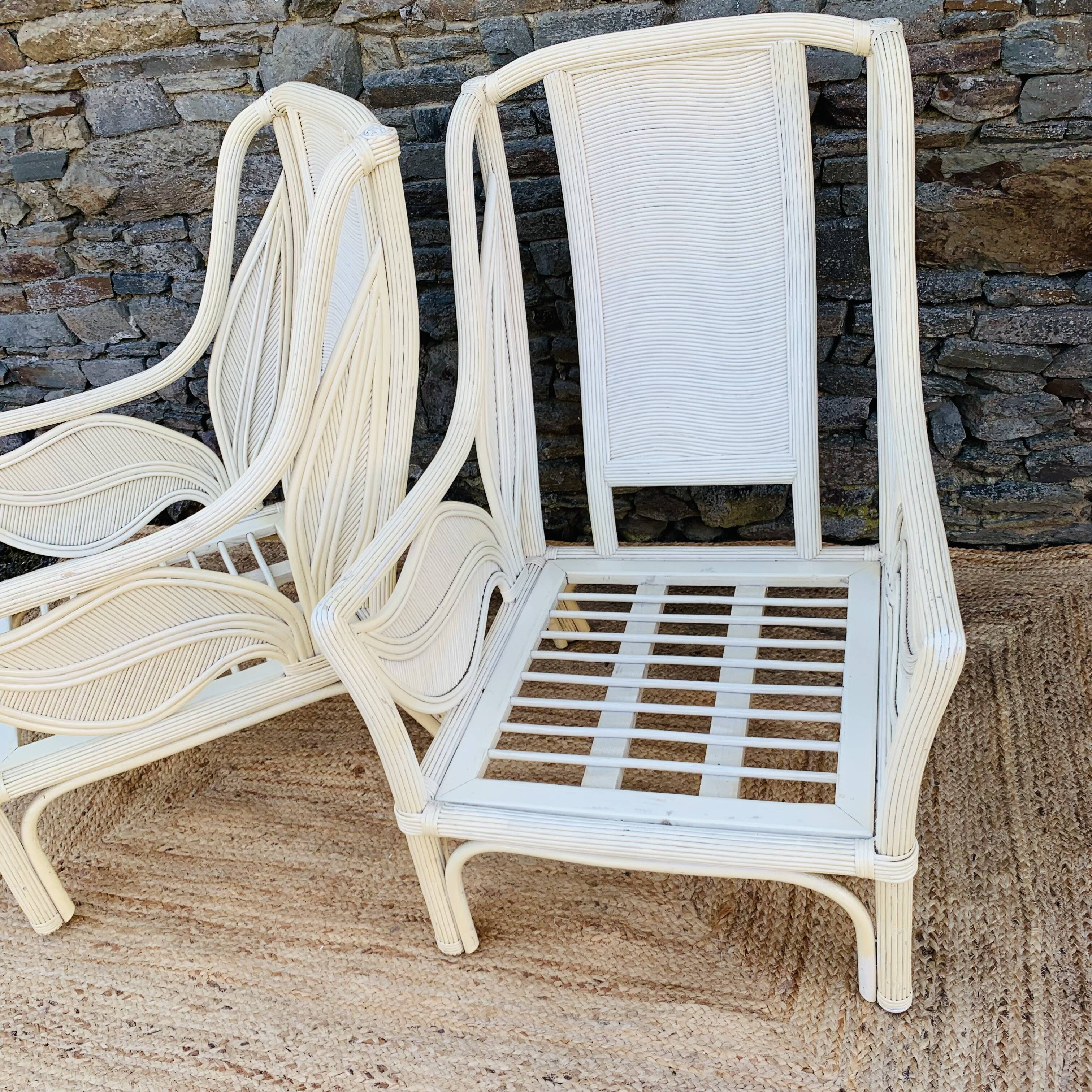 Pair of white rattan armchairs