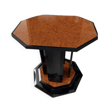 Octagonal dining table by Paul Michel in elm burl and black lacquer.