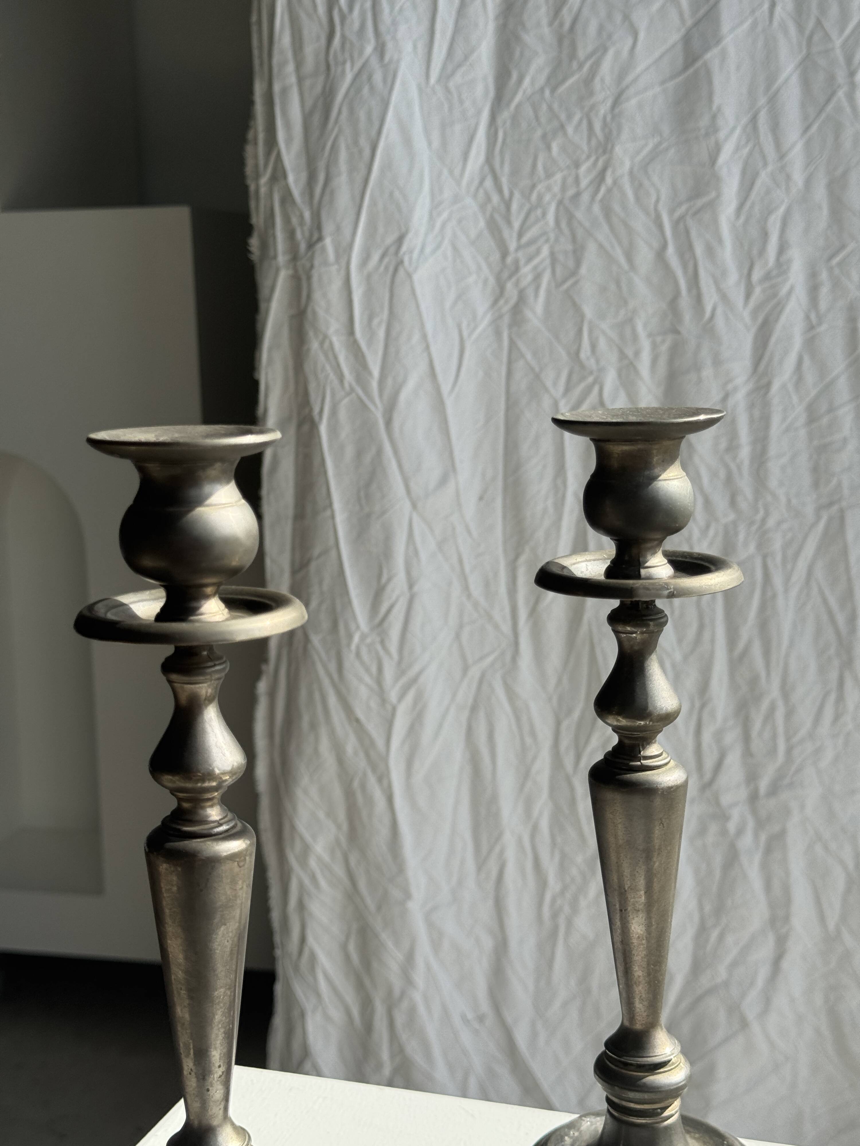Two large antique silver-plated metal candlesticks, H30