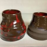 Pair of red vases in the shape of an elephant's foot
