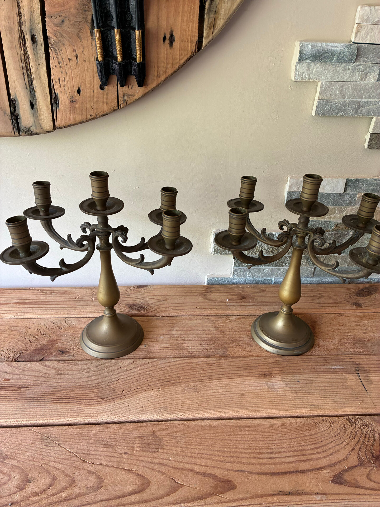 Pair of large 5-light candlesticks in patinated brass, classical style.