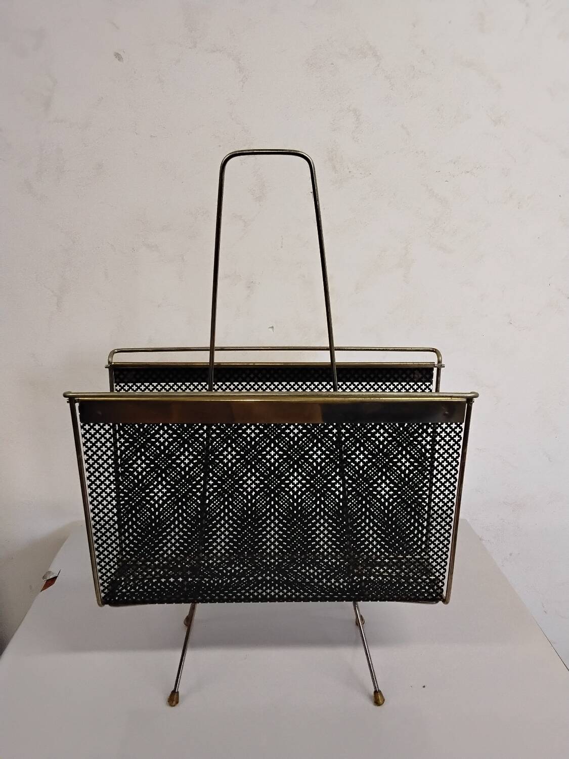 Vintage gold magazine rack from the 1960s.
