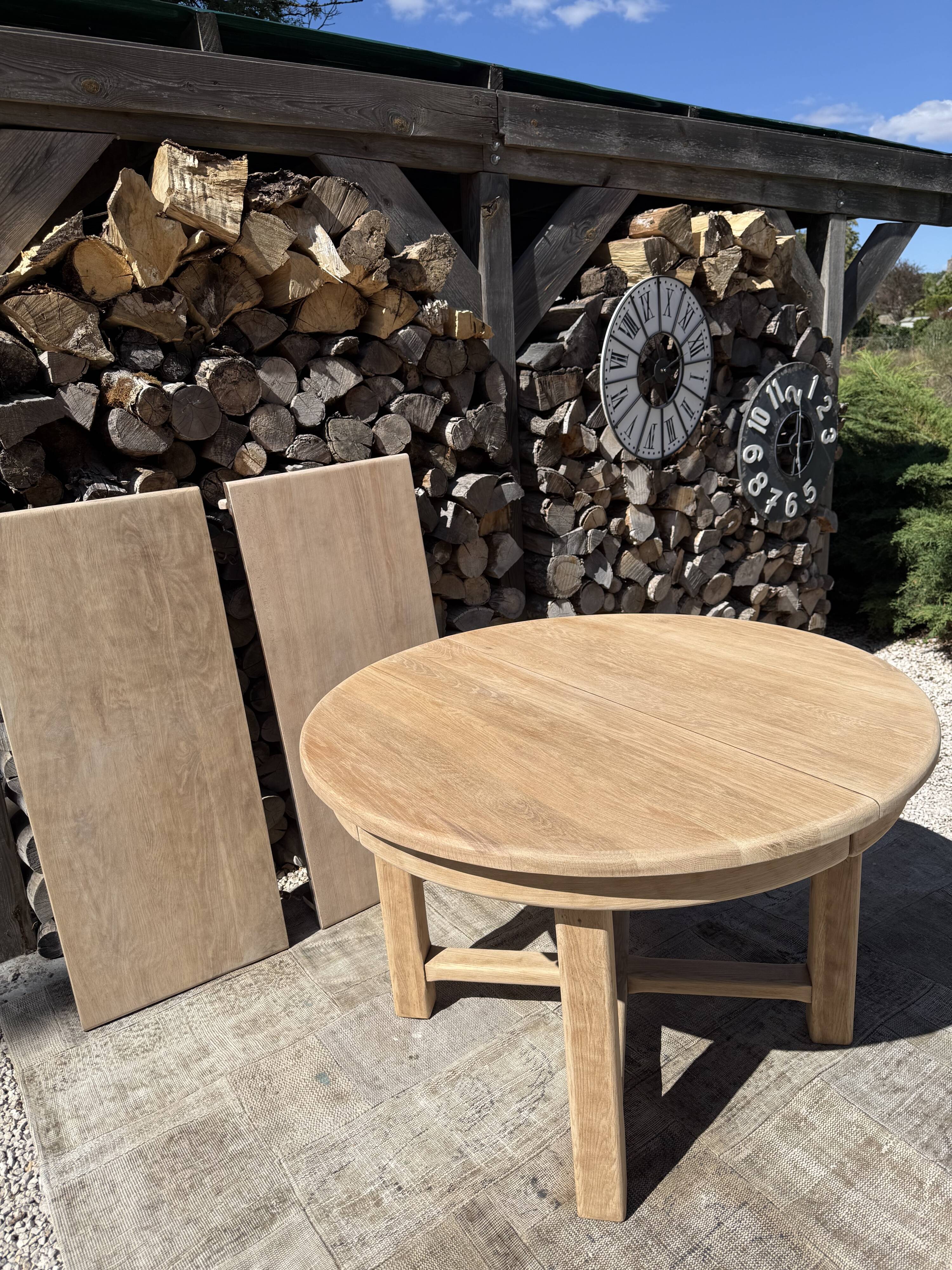 Round solid oak table with extensions, maximum 220cm.