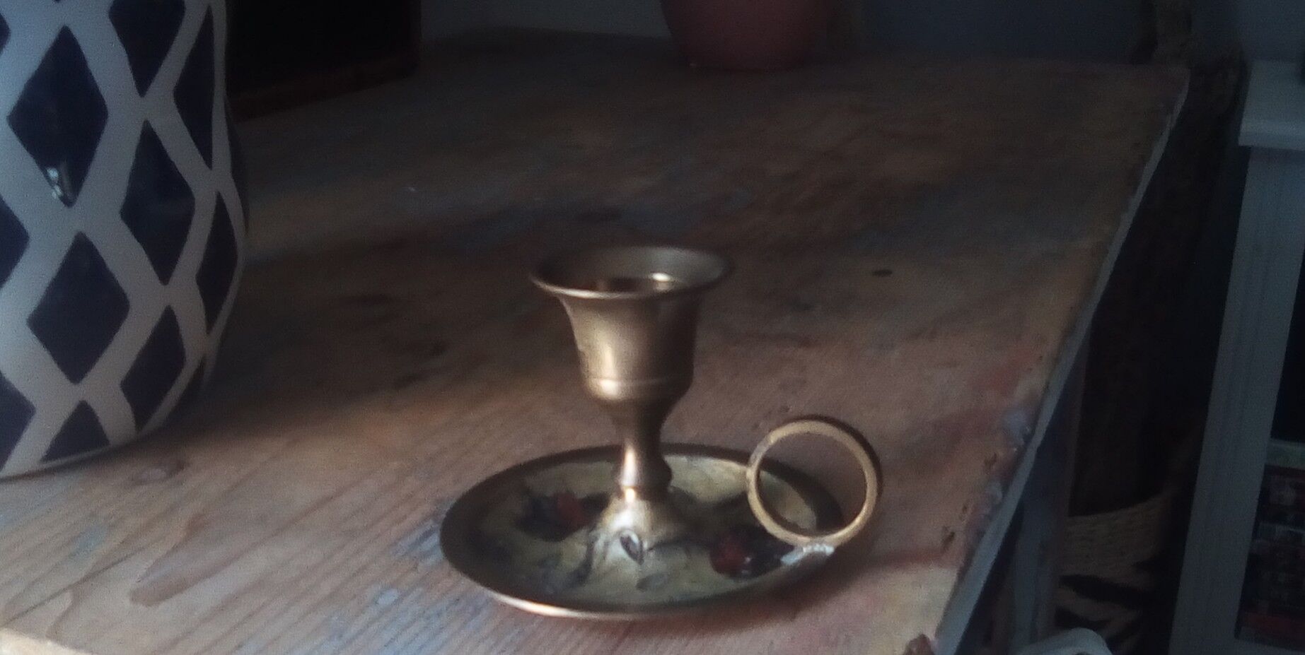 Vintage candlestick in brass cellar rat
