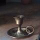 Vintage candlestick in brass cellar rat