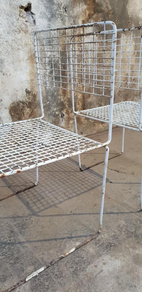 Two vintage metal chairs