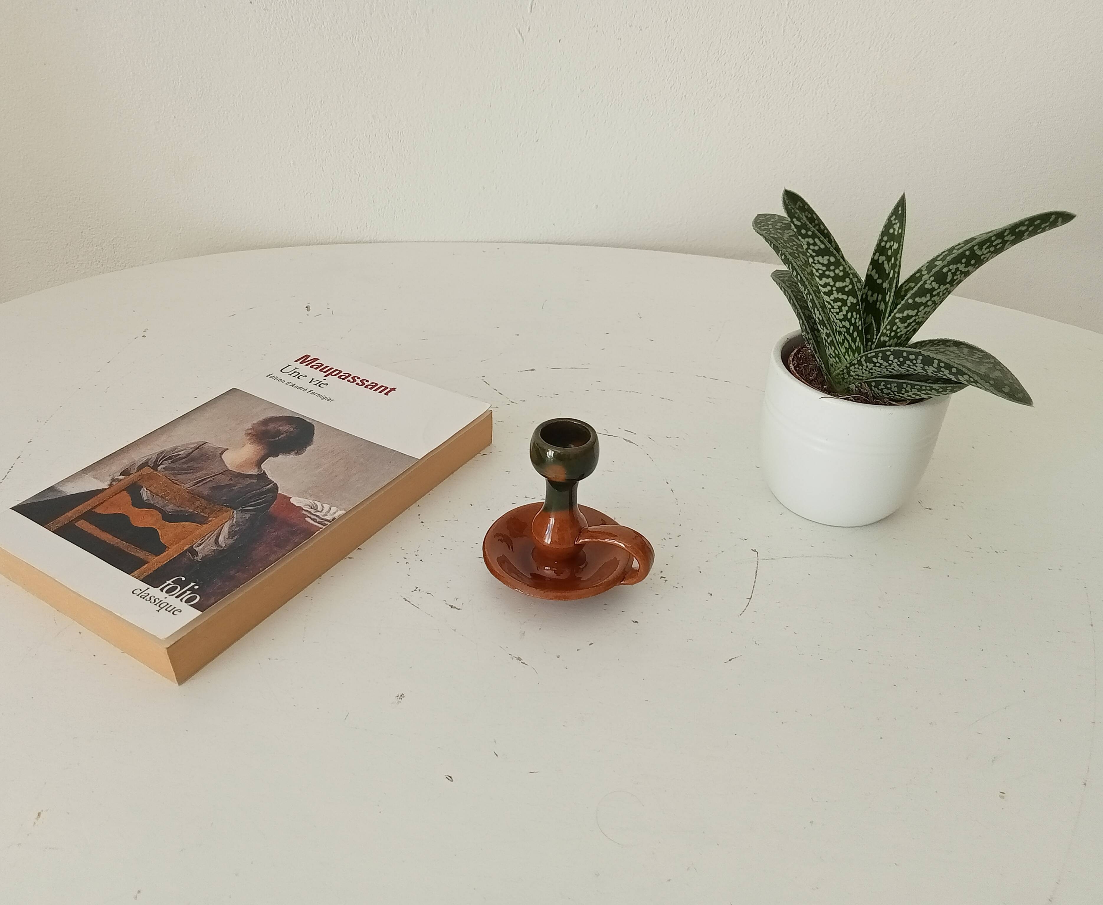 Vintage hand-held candlestick in glazed ceramic