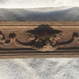 Natural wood pediment with bunches of grapes
