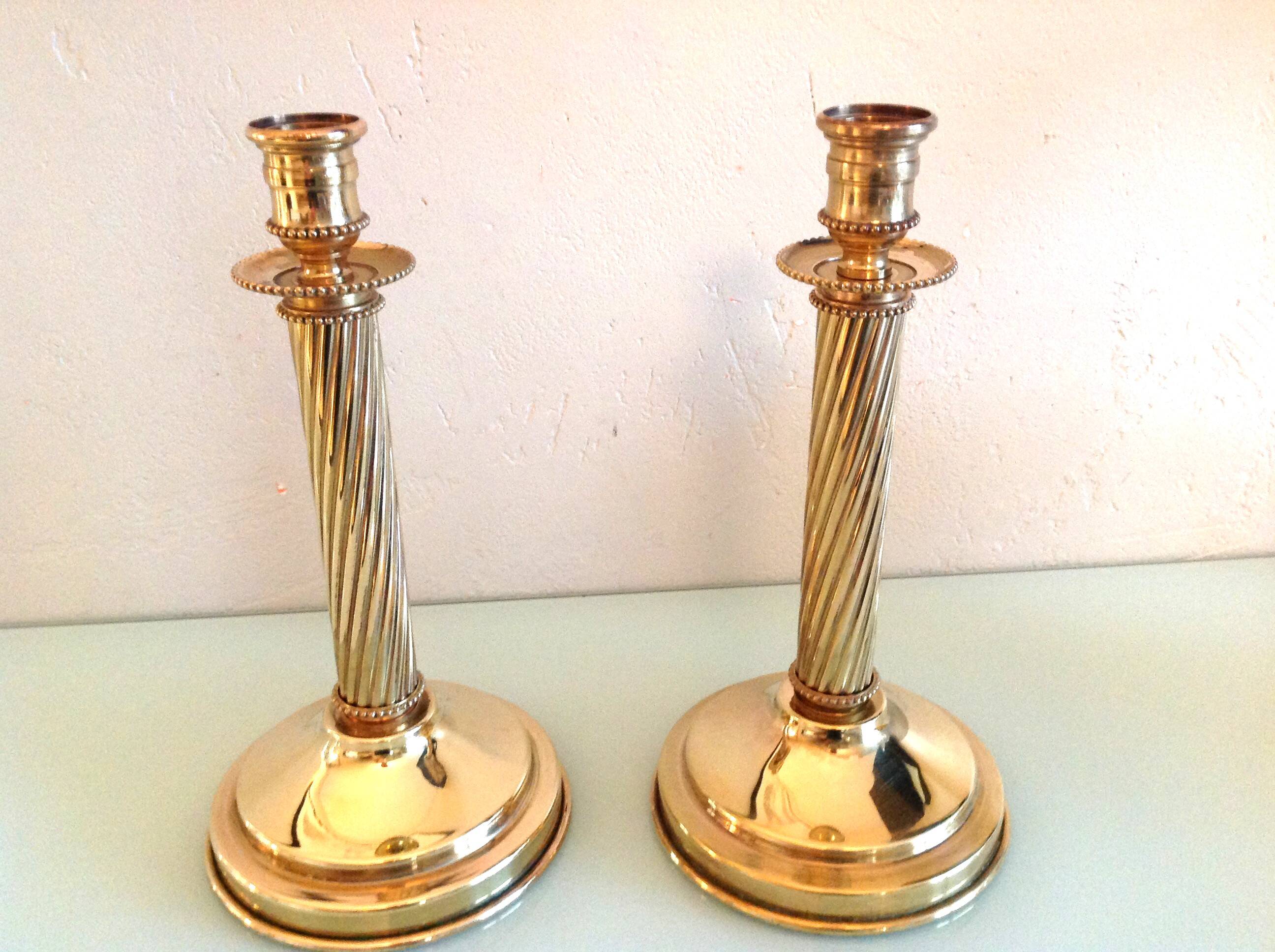 Pair of empire style brass candlesticks