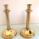 Pair of empire style brass candlesticks