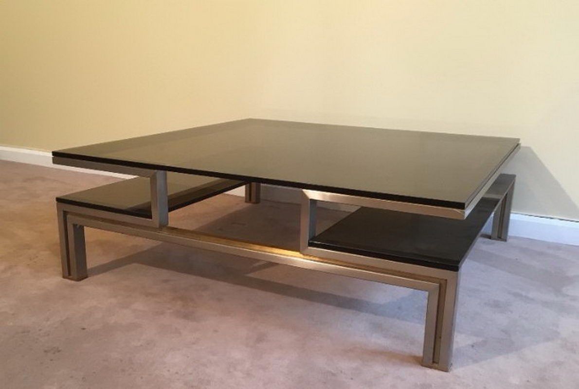 Very nice coffee table in brushed steel and brass