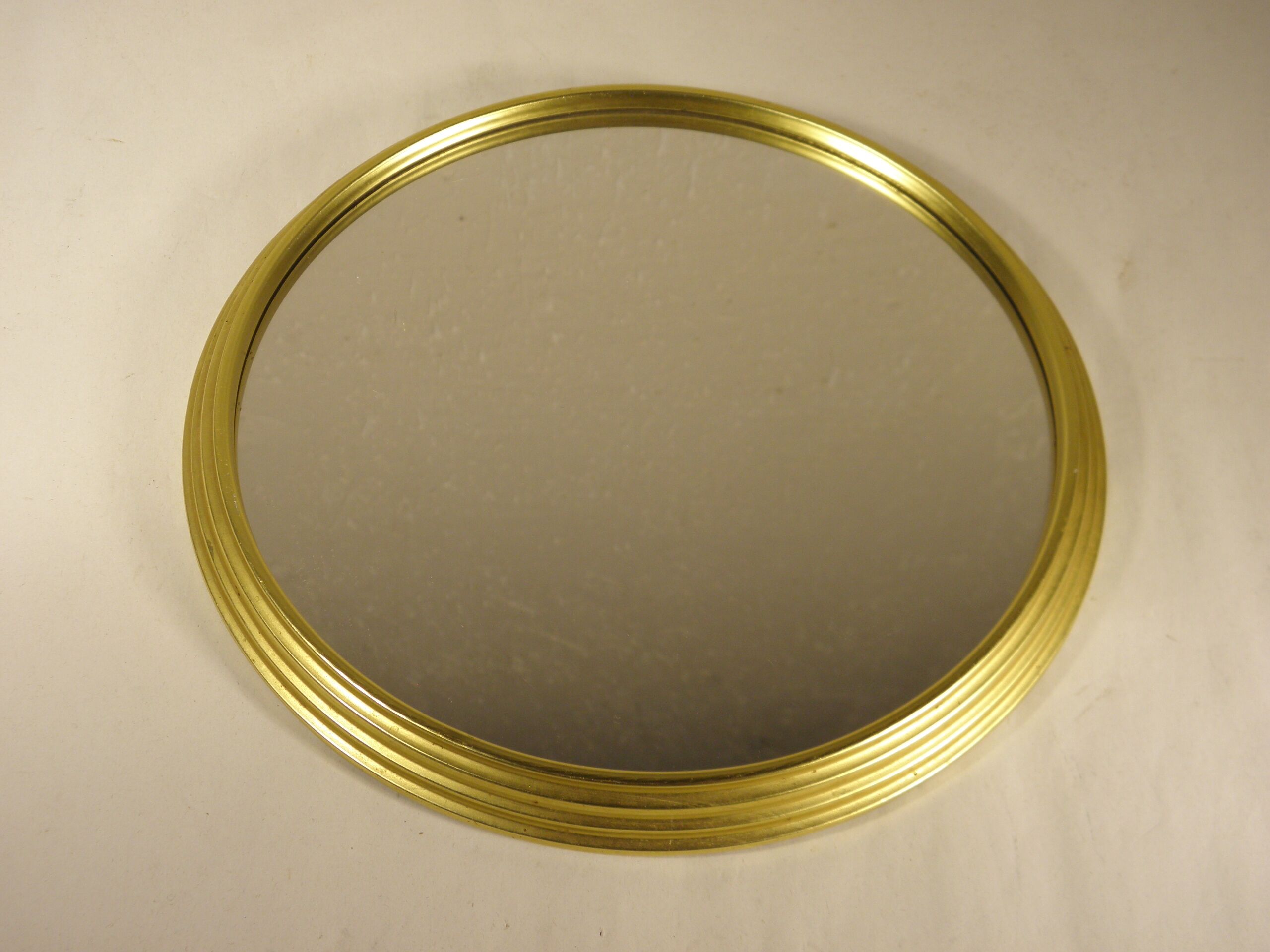 Golden round mirror