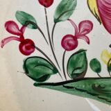 Old plate with flower and rooster pattern