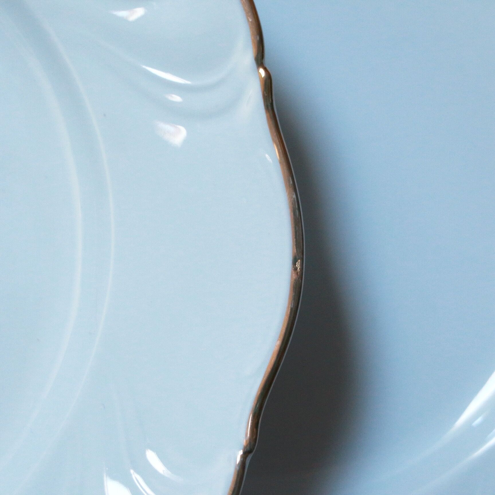 White and gold porcelain plates