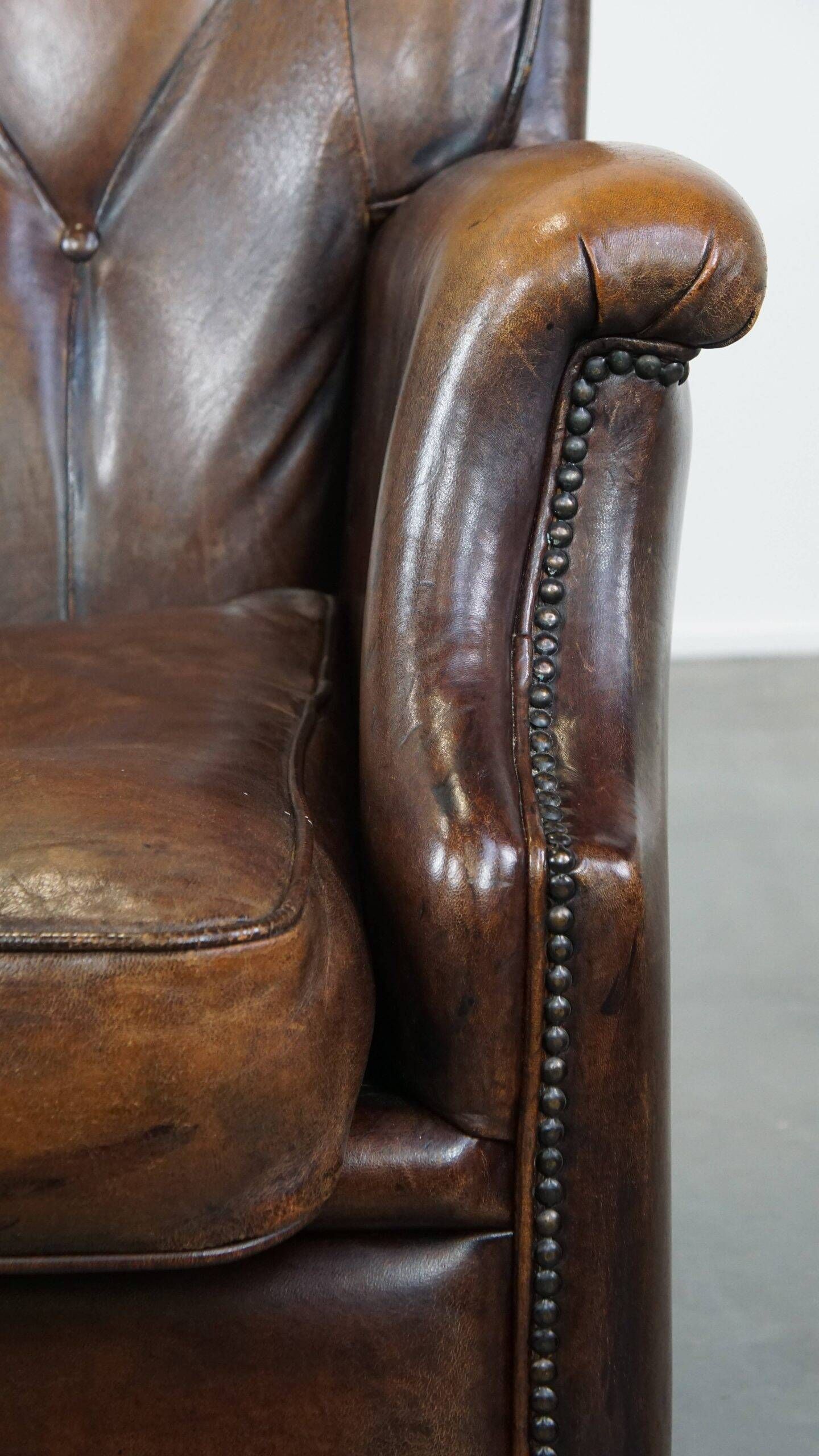 Vintage sheepskin armchair in a dark cognac colour with a comfortable seat