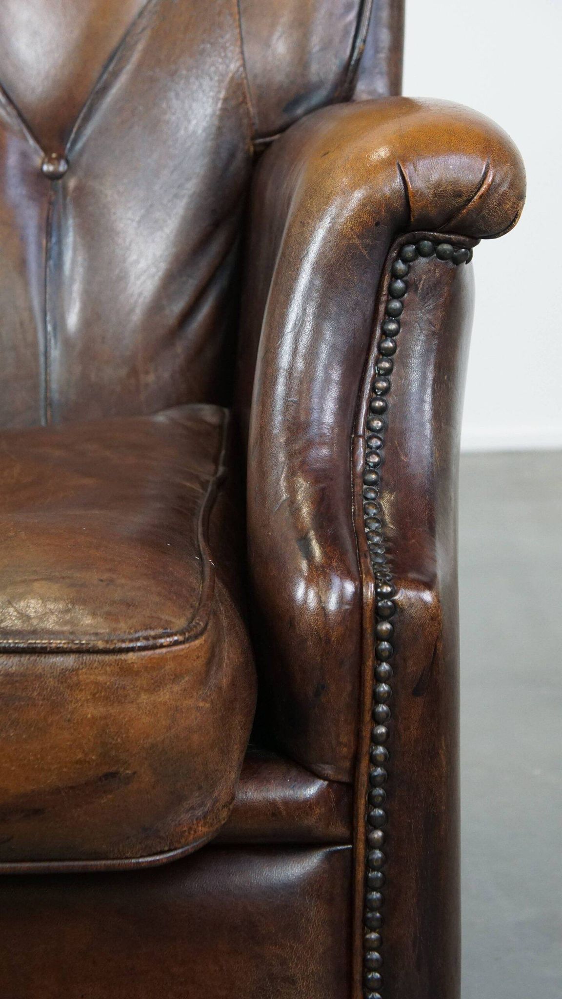 Vintage sheepskin armchair in a dark cognac colour with a comfortable seat