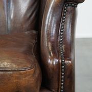 Vintage sheepskin armchair in a dark cognac colour with a comfortable seat